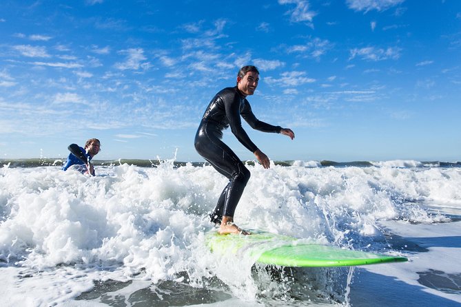 Private Surf Lesson with Instructor, Board, & Wetsuit - Getting suited up at the surf van