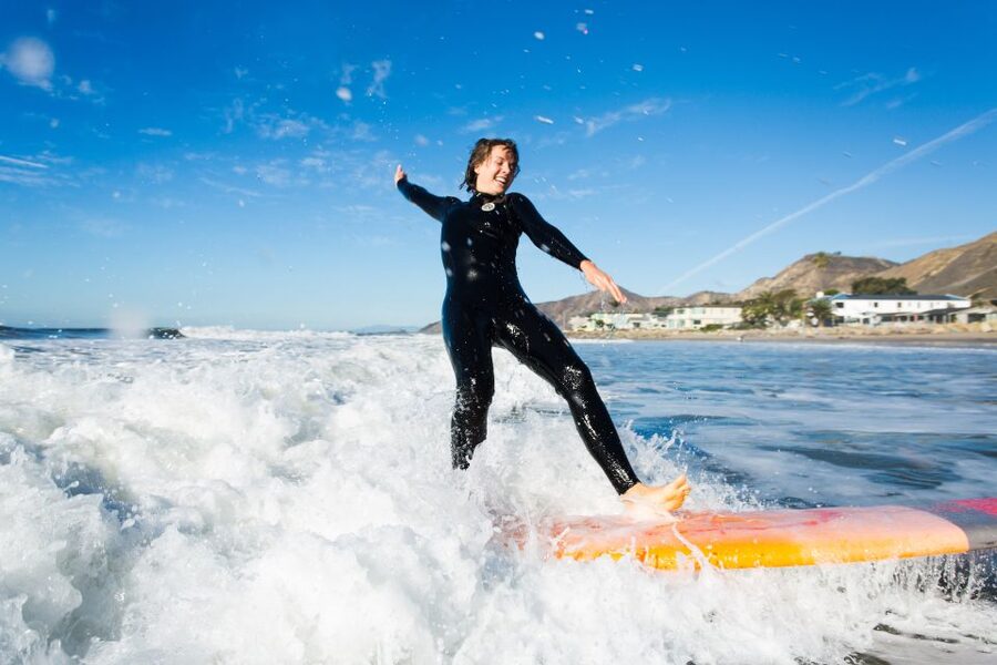 Santa Barbara: 1.5-Hour Private Beginner's Surf Lesson - Paddling out and catching your first waves
